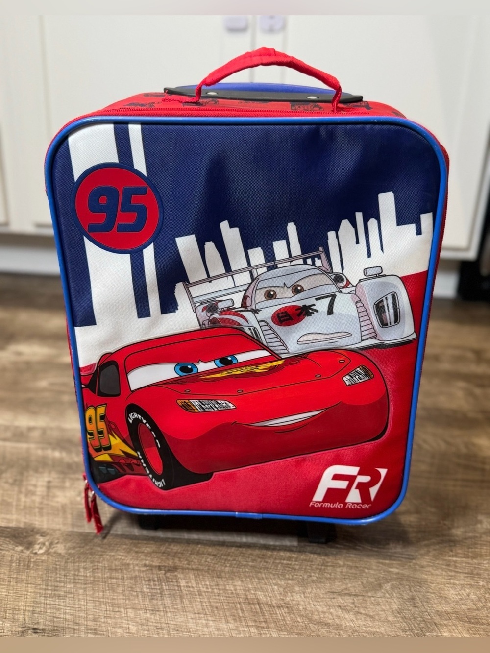 Disney Pixar Cars Lightening McQueen Rolling Carry-on with Retractable Handle.